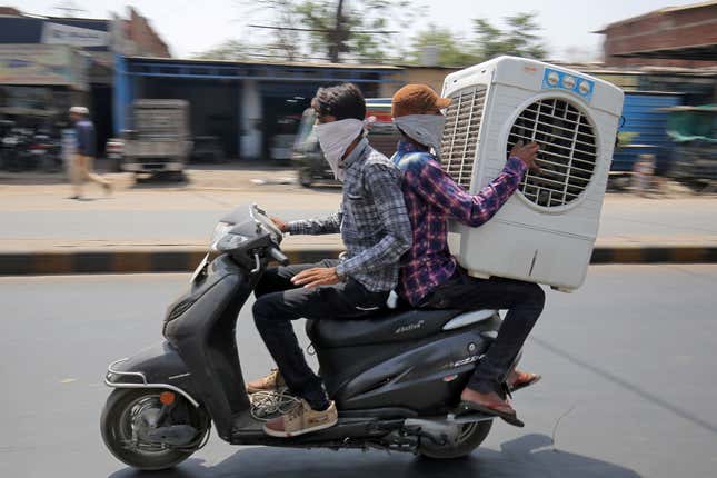 Image for article titled Untimely rains have piled on trouble for two-wheeler sales in India