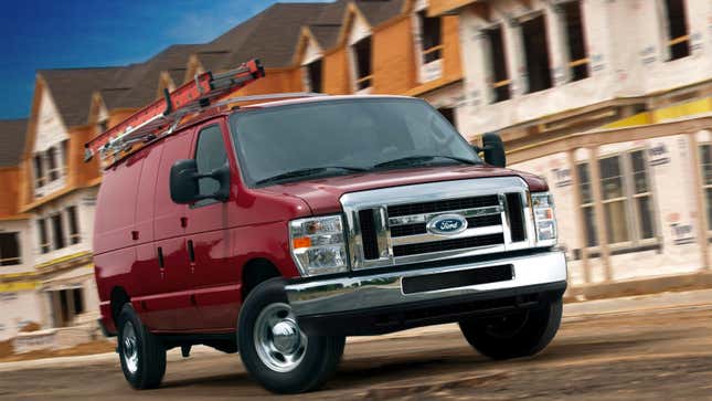 A red Ford E-350 cargo van 