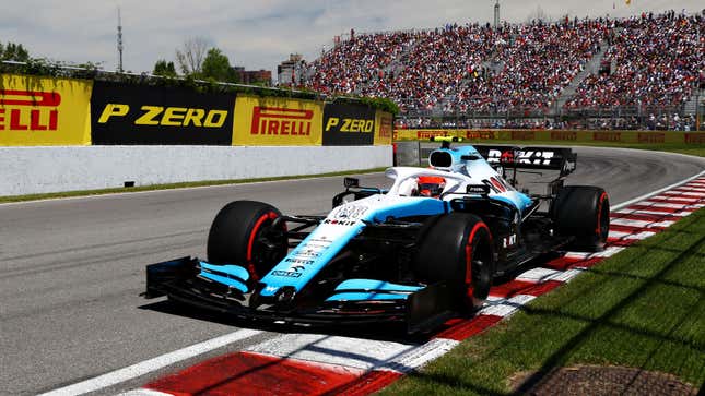 A photo of the blue and white Williams F1 car racing in Canada. 