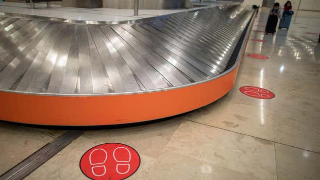 A baggage claim carousel at Adolfo Suarez-Madrid Barajas Airport
