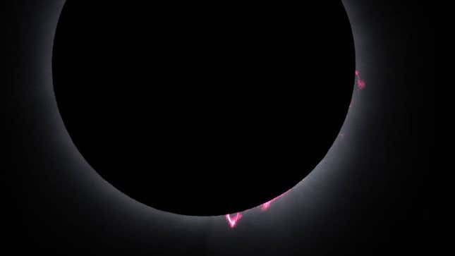 This image effectively captures the red and pink hues of the prominences.