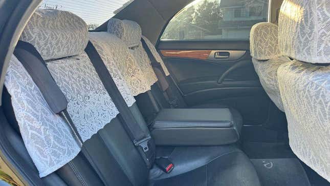A photo showing the rear seats and their lace seat covers