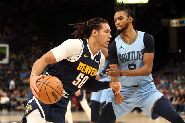 Oct 27, 2023; Memphis, Tennessee, USA; Denver Nuggets forward Aaron Gordon (50) moves to the basket as Memphis Grizzlies forward Ziaire Williams (8) defends during the first half at FedExForum.