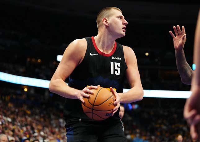 Nov 14, 2023; Denver, Colorado, USA; Denver Nuggets center Nikola Jokic (15) controls the ball in the second half against the LA Clippers at Ball Arena.