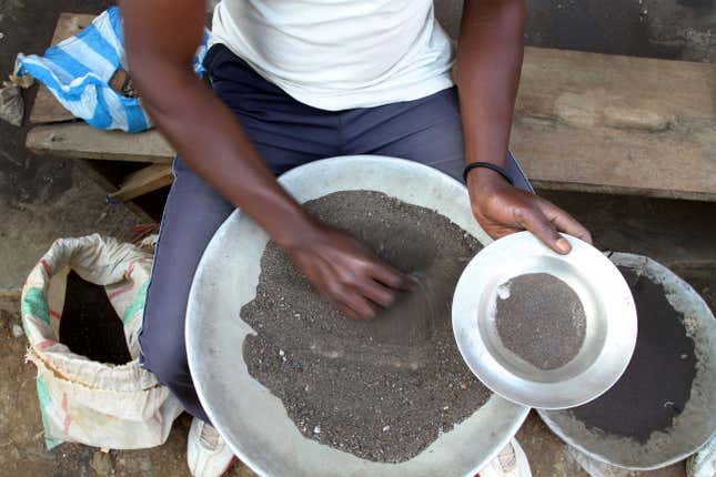 FILE - A Congolese miner sifts through ground rocks to separate out the cassiterite, the main ore that&#39;s processed into tin, in the town of Nyabibwe, eastern Congo, Aug. 16, 2012. Congo’s government is questioning Apple about the tech company’s knowledge of “blood minerals” from a conflict zone in the African country that could be smuggled into supply chains. A group of international lawyers representing Congo said Thursday, April 25, 2024, that it sent letters to Apple’s CEO Tim Cook and its French subsidiary this week raising concerns about human rights violations involving the minerals extracted from mines in the country’s war-torn east. (AP Photo/Marc Hofer, File)