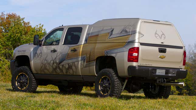 A silver Chevrolet Silverado with a rear cover 