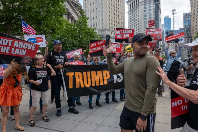 People react moments after news that former U.S. President Donald Trump was found guilty in his trial on hush-money payments in Manhattan Criminal Court on May 30, 2024 in New York City. 