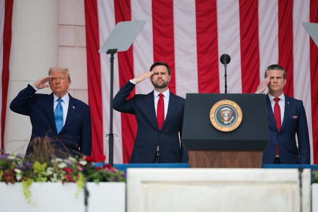 (L-R) U.S. President Donald Trump, U.S. Vice President JD Vance, and U.S. Secretary of Defense Pete Hegseth greet visitors during the Memorial Day wreath-laying ceremony at the Memorial Amphitheater in Arlington National Cemetery on May 26, 2025 in Arlington, Virginia. Memorial Day is observed on the last Monday in May each year to honor and mourn U.S. military personnel who died while serving in the United States Armed Forces.