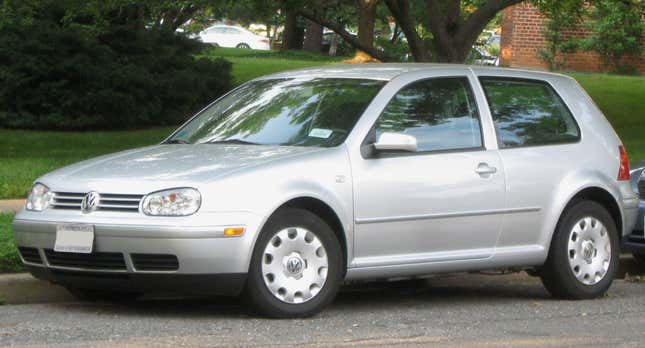 A silver Mk4 Golf parked in front of grass