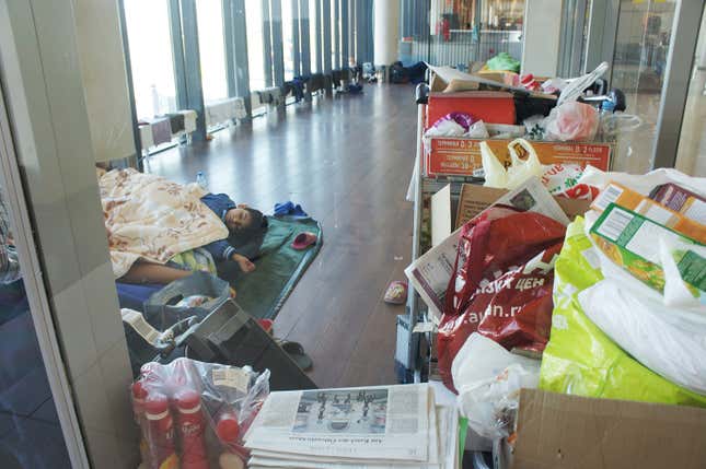 Image for article titled Photos: A family of Kurdish refugees is living in a Moscow airport lounge