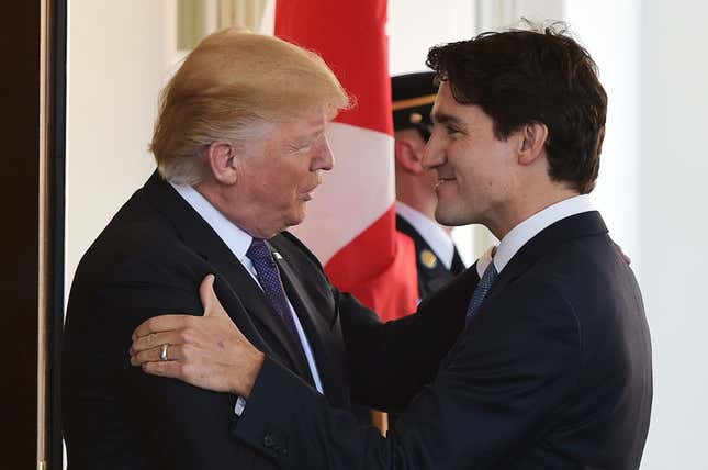 US President Donald Trump (L) greets Canada’s Prime Minister Justin Trudeau (R). 