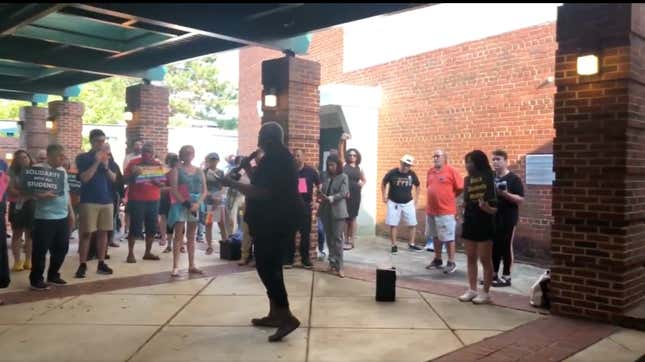 Michelle Leete speaking to a crowd outside a Fairfax County School Board meeting. 