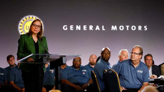 General Motors Chairman and CEO Mary Barra speaks while and United Auto Workers President Gary Jones (right) listens before they opened the 2019 GM-UAW contract talks with the traditional ceremonial handshake on July 16, 2019 in Detroit, Michigan. With its increasing investment in electric vehicles, GM is faced with the challenge of transitioning its employees to work with new technologies. 