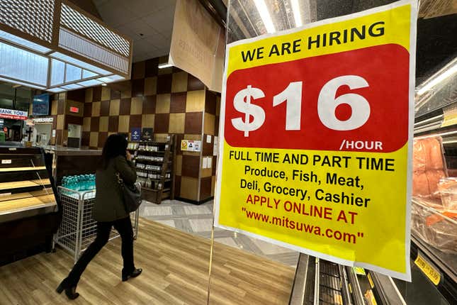 A hiring sign is displayed at a grocery store in Arlington Heights, Ill., Tuesday, Oct. 10, 2023. On Thursday, the Labor Department reports on the number of people who applied for unemployment benefits last week. (AP Photo/Nam Y. Huh)