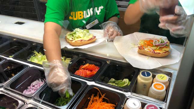 subway employees making sandwiches