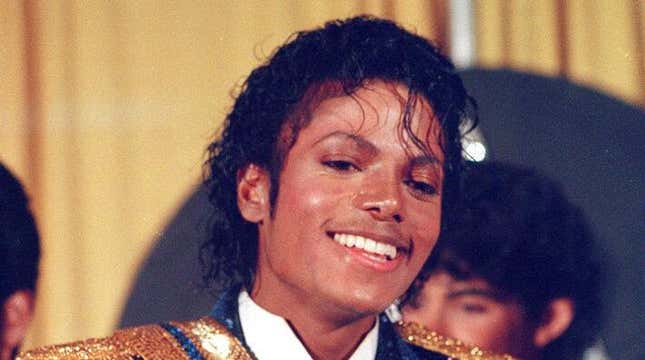 Michael Jackson is seen backstage at the 26th annual Grammy Awards in Los Angeles Tuesday, Feb. 28, 1984, as he poses with the awards he won in eight different categories.
