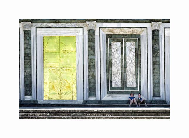 People rest outside the abbey of San Miniato al Monte