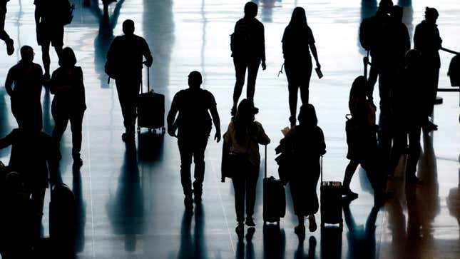 FILE - People pass through Salt Lake City International Airport, June 27, 2022, in Salt Lake City. The cost of travel has fluctuated sharply in recent years, but travelers expecting high prices now might be in for a pleasant surprise. Data show that many travel expenses, including airfare, have decreased recently. Domestic flights in particular have been less expensive, and while international airfare remains elevated, it too is coming down as airlines slowly add more capacity. (AP Photo/Rick Bowmer, file)