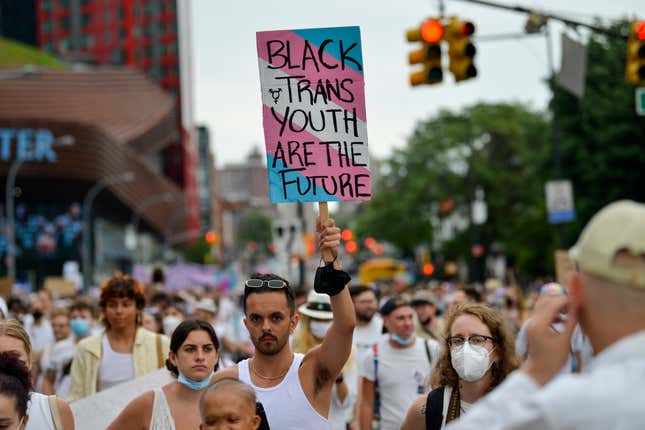 NEW YORK, NEW YORK - JUNE 13: A protestors carries a “Black Trans Youth Are The Future” during the Brooklyn Liberation: An action for Trans Youth March on June 13, 2021 in the Brooklyn Borough of New York City. On May 19, 2021 New York Governor Andrew Cuomo lifted all coronavirus pandemic restrictions paving the way for most Pride month events to resume normally. New York City Pride weekend will be June 25th-27th