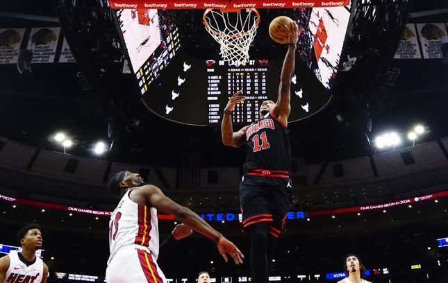 Nov 18, 2023; Chicago, Illinois, USA; Miami Heat center Bam Adebayo (13) defends Chicago Bulls forward DeMar DeRozan (11) during the second half at United Center.