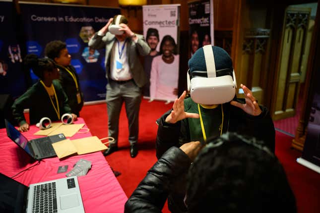 Primary school children taking a spin in the Metaverse at the London Careers Festival in February 2024.