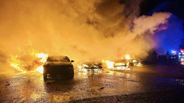 A photo of cars on fire at an auction house in Texas. 