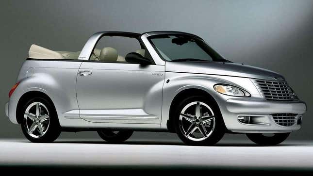 A silver PT Cruiser Convertible shot in a studio