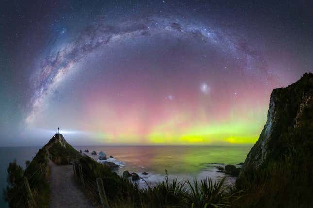 A pinkish-yellow aurora over New Zealand.
