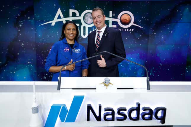 NEW YORK, NEW YORK - JULY 19: Astronaut Jeanette Epps and CFO Jeff DeWit of NASDAQ pose as NASA rings the closing bell at NASDAQ on July 19, 2019 in New York City