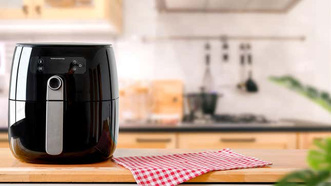 A clean air fryer device on a kitchen countertop.