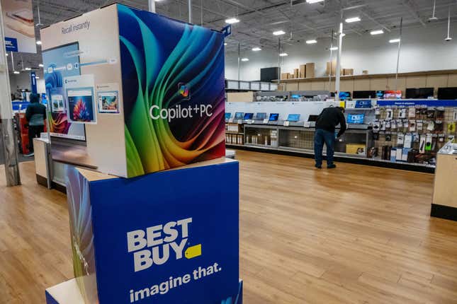 A Microsoft Copilot + PC sign inside a Best Buy store on Black Friday in Pinole, California, US, on Friday, Nov. 29, 2024.