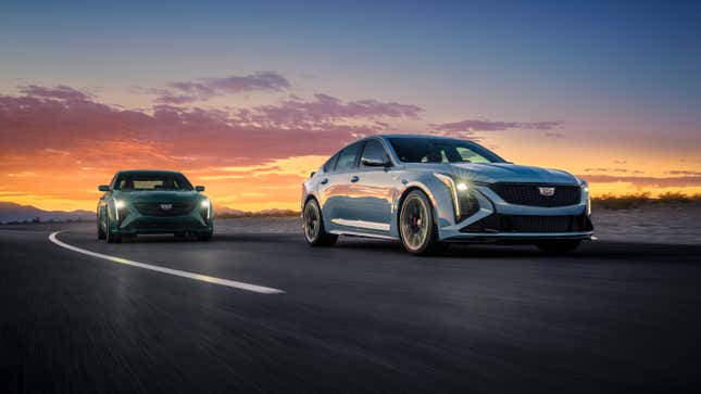 Two Cadillac CT-5 Blackwing sedans driving on a desert road