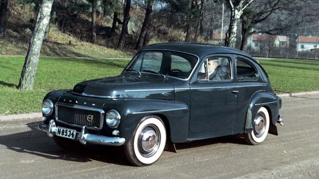 A photo of a vintage blue Volvo car. 