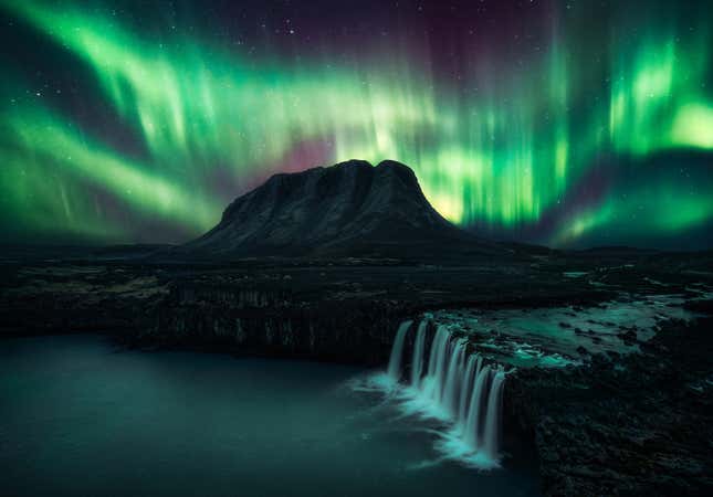 The lights and a waterfall in Iceland.