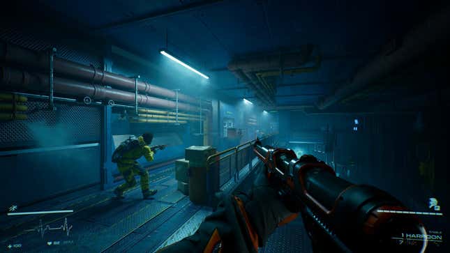 A player crouches in an industrial hallway