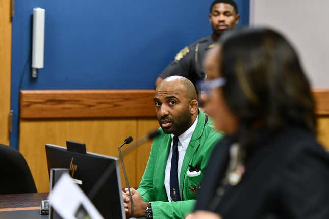 ATLANTA, GEORGIA - NOVEMBER 21: Harrison Floyd listens as Fulton County District Attorney Fani Willis speaks to Judge Scott McAfee during a hearing in the 2020 Georgia election interference case at the Fulton County Courthouse on November 21, 2023 in Atlanta, Georgia.