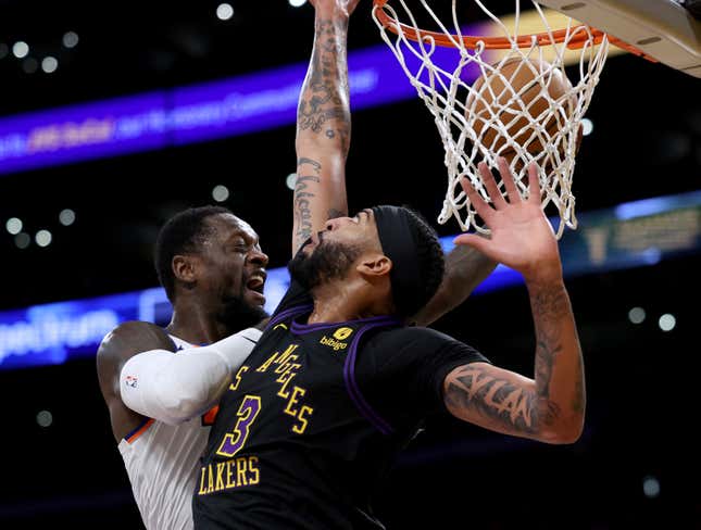 LOS ANGELES, CALIFORNIA - DECEMBER 18: dJulius Randle #30 of the New York Knicks reacts on his layup around Anthony Davis #3 of the Los Angeles Lakers during the first half at Crypto.com Arena on December 18, 2023 in Los Angeles, California. NOTE TO USER: User expressly acknowledges and agrees that, by downloading and or using this photograph, User is consenting to the terms and conditions of the Getty Images License Agreement. (Photo by Harry How/Getty Images)