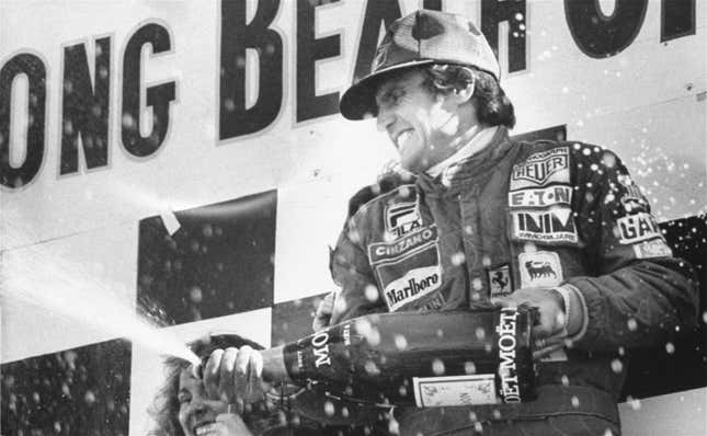 Carlos Reutemann sprays champagne after winning the 1978 Long Beach Grand Prix.