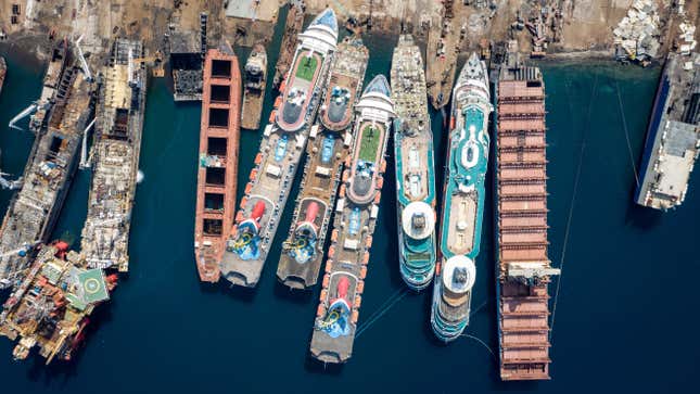 In this aerial view from a drone, five luxury cruise ships are seen being broken down for scrap metal at the Aliaga ship recycling port on October 02, 2020 in Izmir, Turkey. 