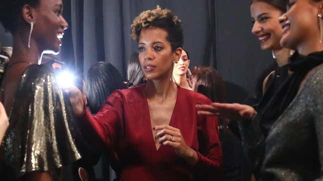 Carly Cushnie, center, prepares models backstage at the Cushnie show during NY Fashion Week on February 8, 2019, in New York City.