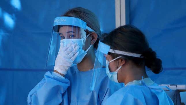 Medical staff wearing protective gear prepare for covid-19 testing at a temporary test facility on August 19, 2020 in Seoul, South Korea.