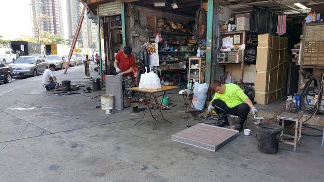 Image for article titled The Most Dedicated Mechanics In The World Wrench On The Streets Of Hong Kong