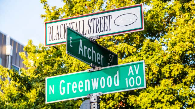 Black Wall Street and N Greenwood Avenue and Archer street signs in Tulsa Okla.