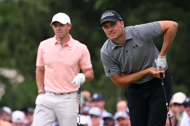 May 20, 2022; Tulsa, Oklahoma, USA; Jordan Spieth (right) watches his shot on the seventh tee alongside Rory McIlroy during the second round of the PGA Championship golf tournament at Southern Hills Country Club.