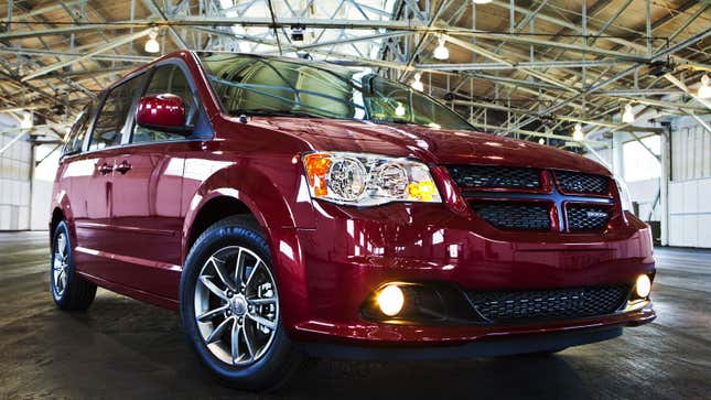 A photo of a red Dodge Grand Caravan minivan