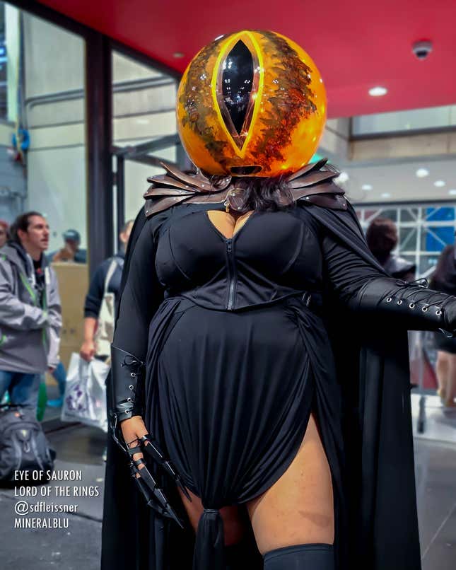 A cosplayer stands dressed as a sexy version of the Eye of Sauron.