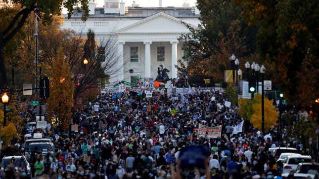 People gather in front of the White House after news media declared Democratic U.S. presidential nominee Joe Biden to be the winner of the 2020 U.S. presidential election, in Washington, U.S., November 7, 2020.