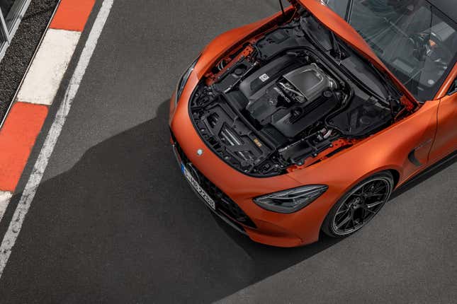 Engine bay of an orange Mercedes-AMG GT63 coupe