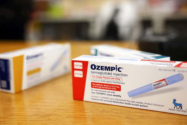 In this photo illustration, boxes of the diabetes drug Ozempic rest on a pharmacy counter on April 17, 2023 in Los Angeles, California. 