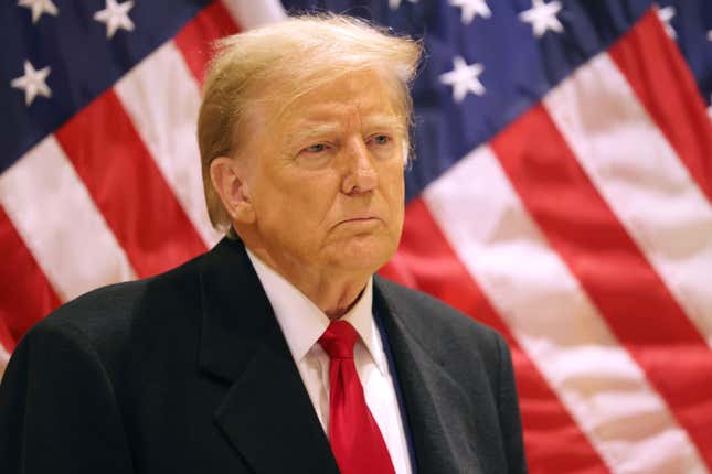 NEW YORK, NEW YORK - MARCH 25: Former President Donald Trump listens as his attorney Todd Blanche speaks during a press conference at 40 Wall Street after a pre-trial hearing on March 25, 2024 in New York City. Judge Juan Merchan scheduled Trump’s criminal trial to begin on April 15, which would make it the first criminal prosecution of a former American president. Trump was charged with 34 counts of falsifying business records last year, which prosecutors say was an effort to hide a potential sex scandal, both before and after the 2016 election.